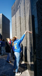Students looking at names on WV Veterans Memorial